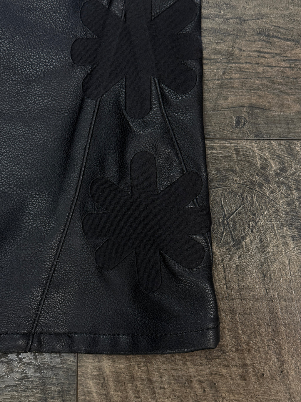LOSTSHDW FLORAL FAUX LEATHER PANTS