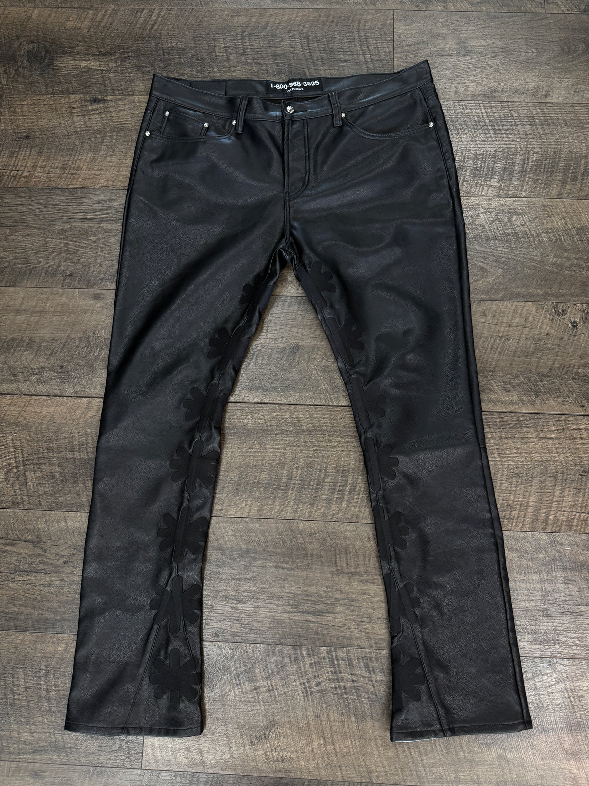 LOSTSHDW FLORAL FAUX LEATHER PANTS