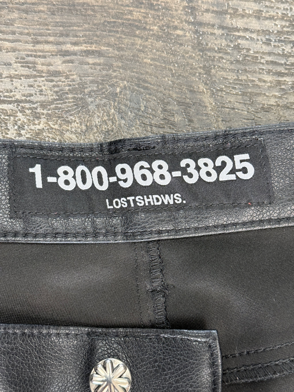 LOSTSHDW FLORAL FAUX LEATHER PANTS
