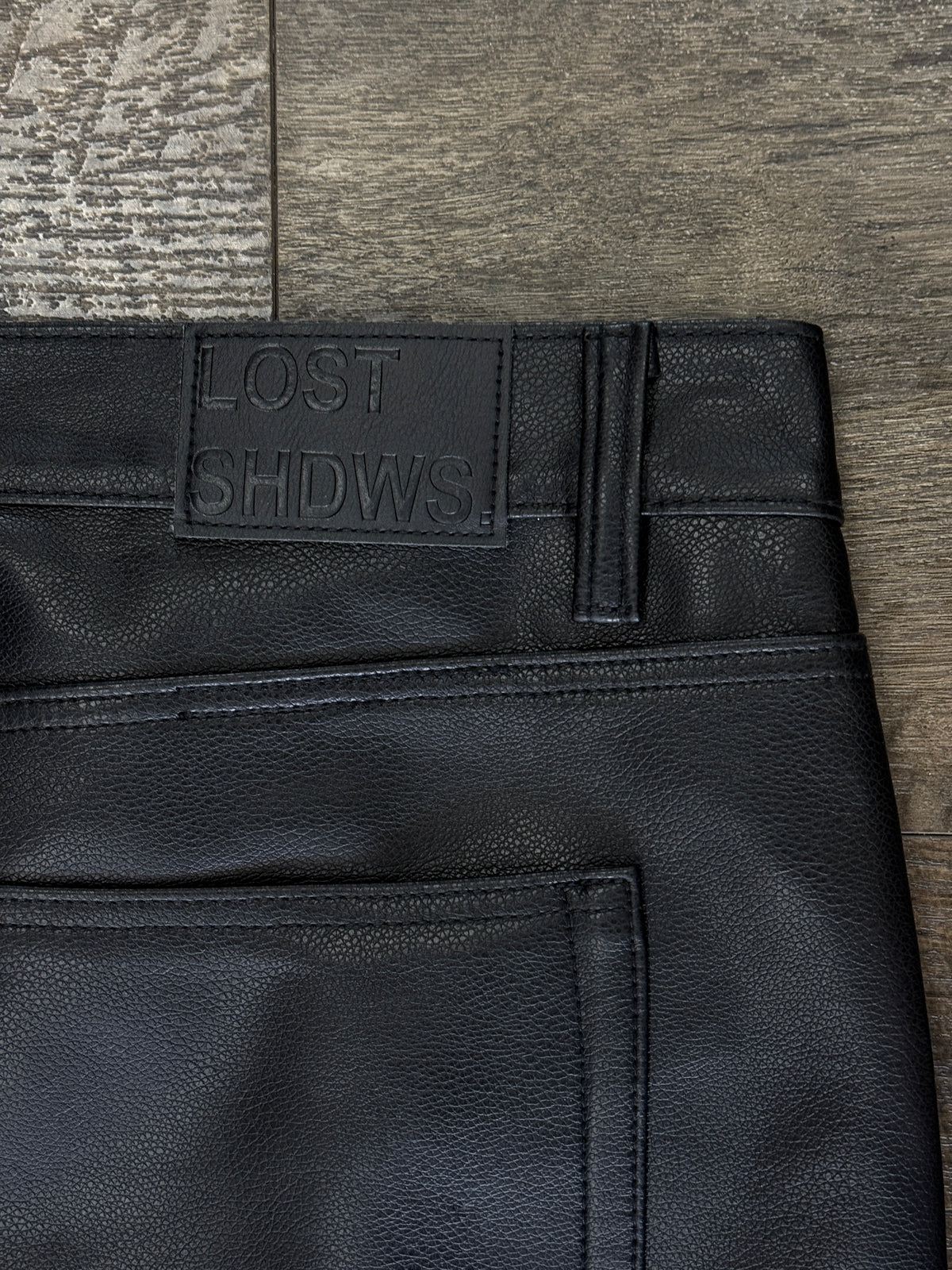 LOSTSHDW FLORAL FAUX LEATHER PANTS