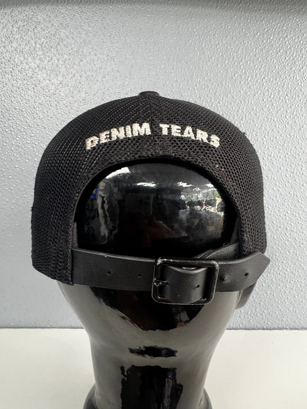 DENIM TEARS WREATH TRUCKER HAT