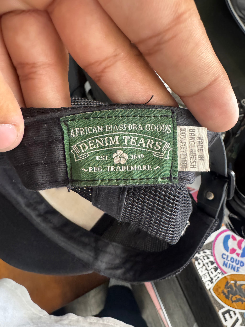 DENIM TEARS WREATH TRUCKER HAT