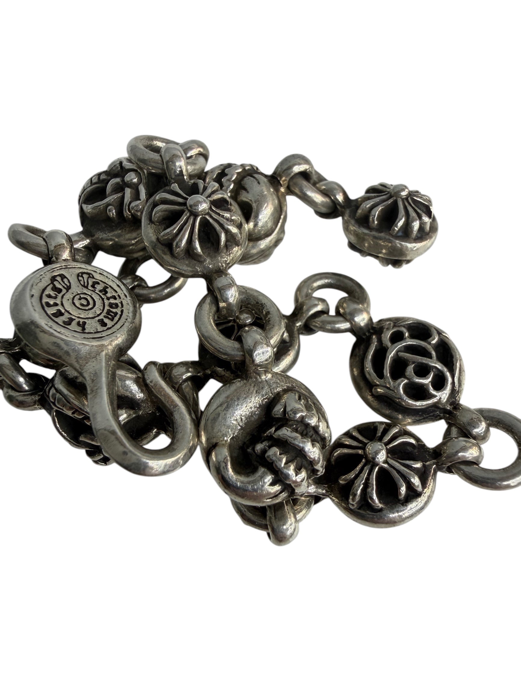 Performa Chrome Hearts sterling silver link bracelet with oxidized gothic cross and knot charms and hook closure.