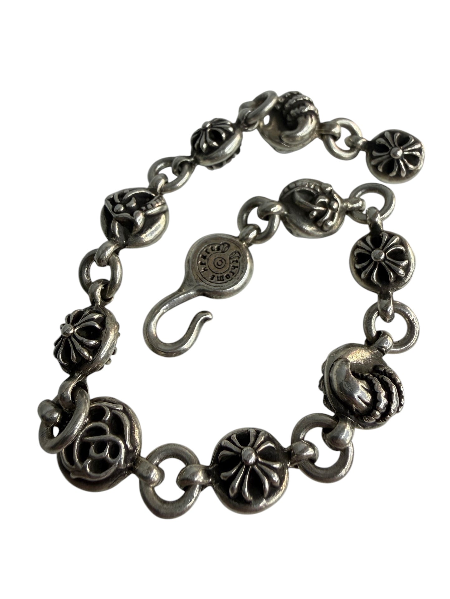 Performa Chrome Hearts sterling silver link bracelet with oxidized gothic cross and knot charms and hook closure.