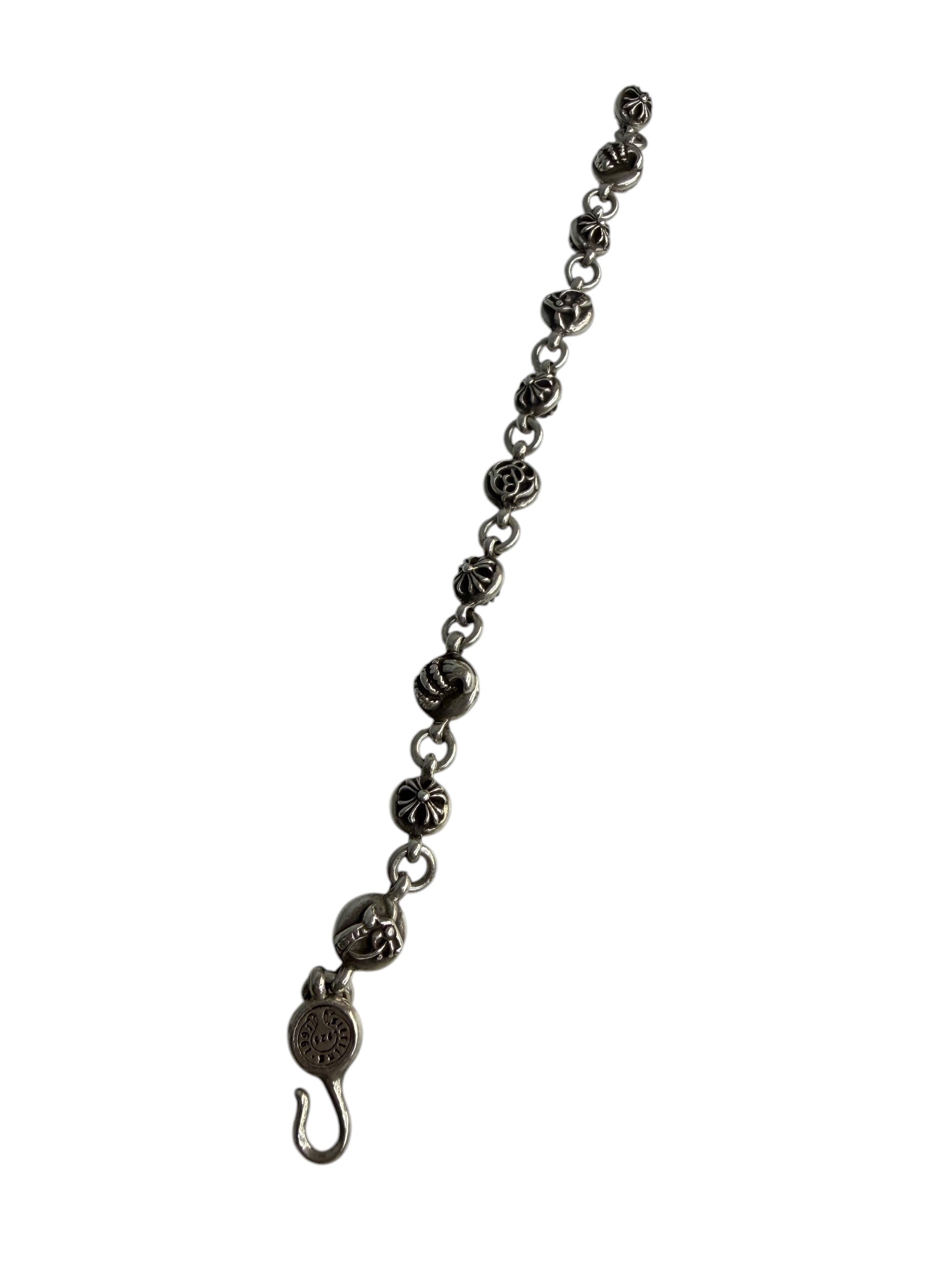 Performa Chrome Hearts sterling silver link bracelet with oxidized gothic cross and knot charms and hook closure.