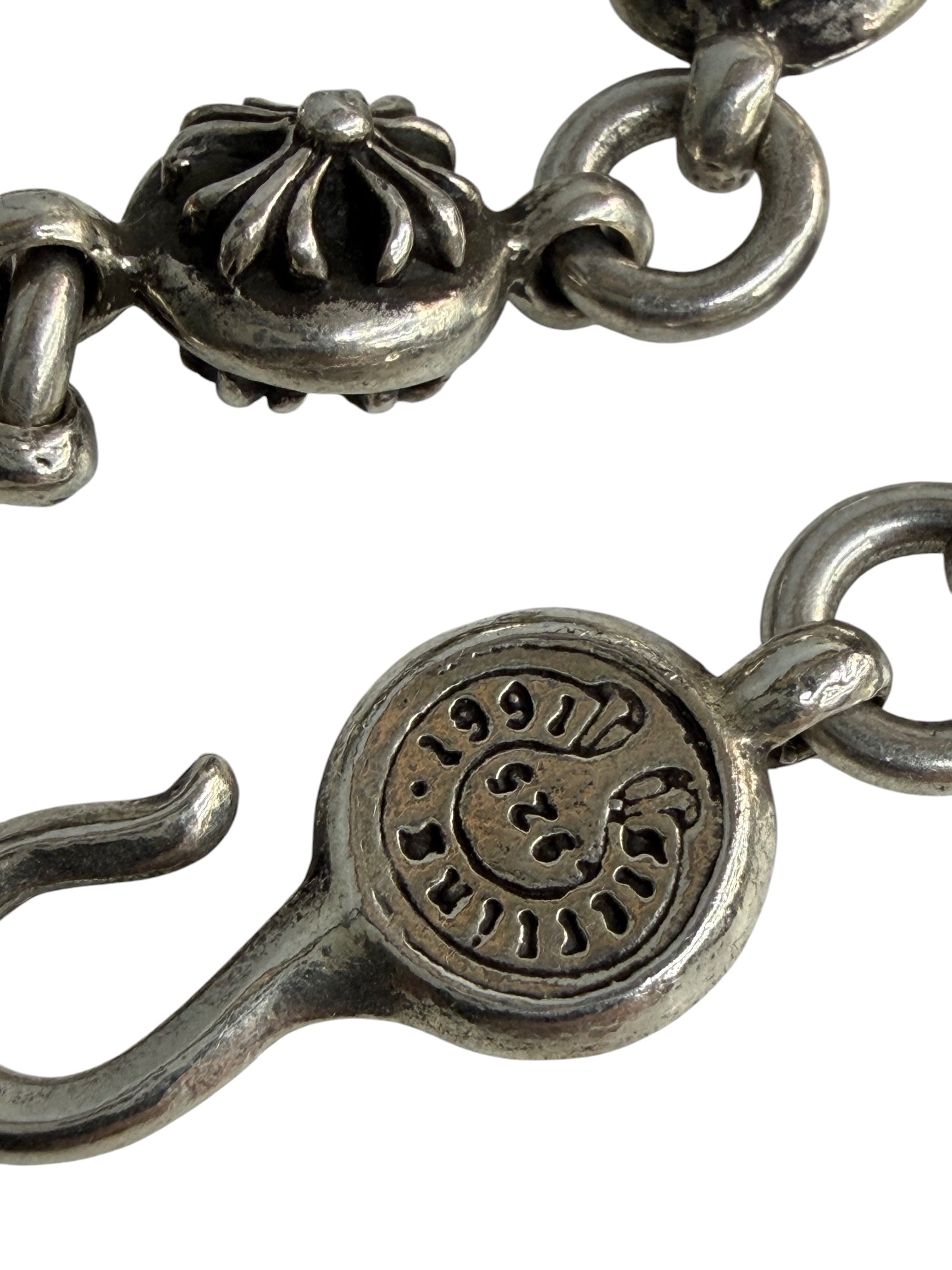 Performa Chrome Hearts sterling silver link bracelet featuring intricate cross motifs and a branded hook-and-eye closure.